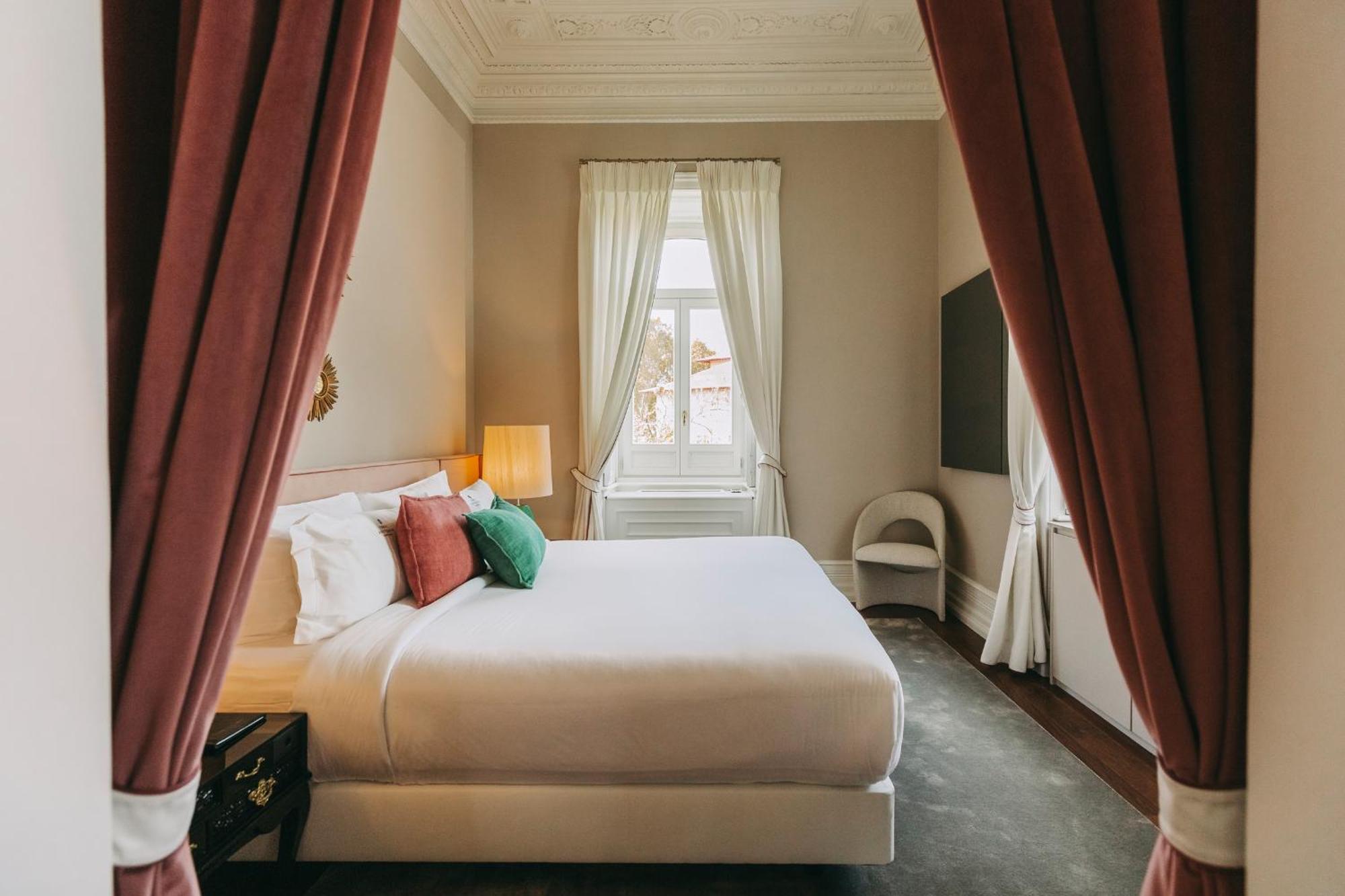 Torel Palace Lisboa Стая снимка A bedroom at the hotel